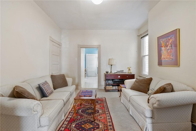 living room featuring light carpet