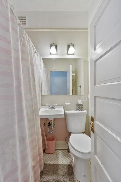 bathroom featuring sink and toilet