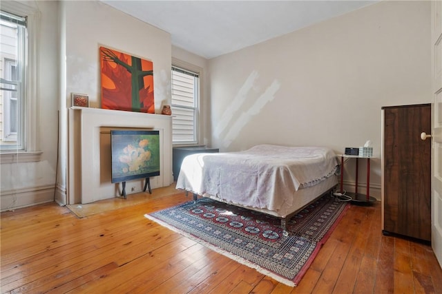 bedroom with wood-type flooring