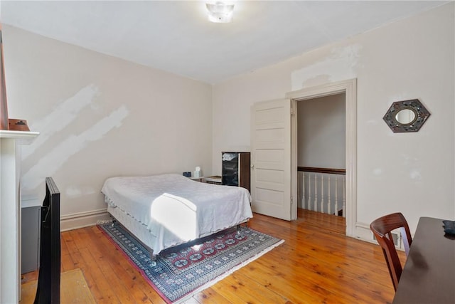 bedroom featuring hardwood / wood-style flooring