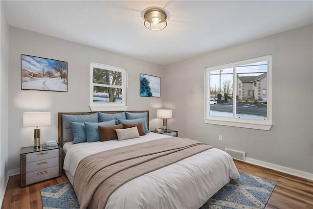 bedroom featuring dark hardwood / wood-style flooring