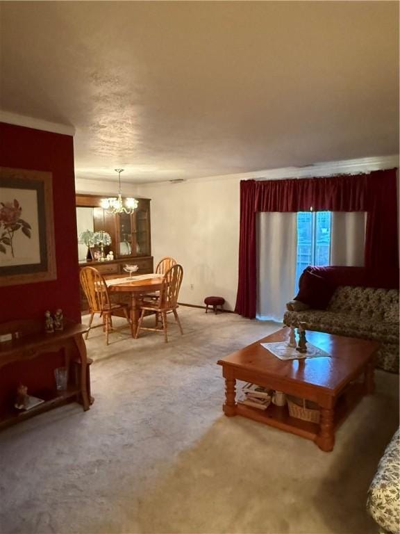 living room with carpet floors and a notable chandelier