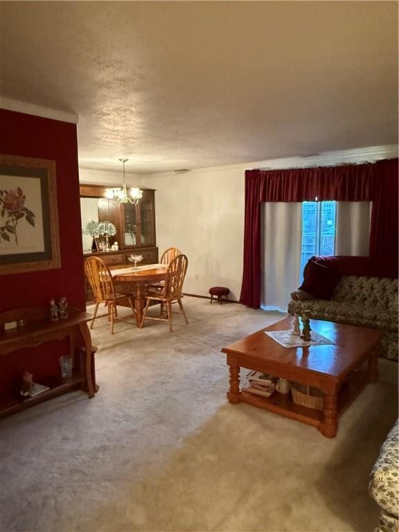 living room with carpet and a notable chandelier