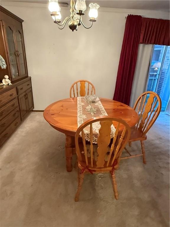 dining space featuring an inviting chandelier