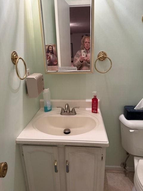 bathroom with vanity and toilet