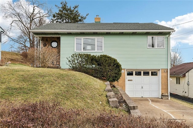 view of front facade with a garage and a front yard