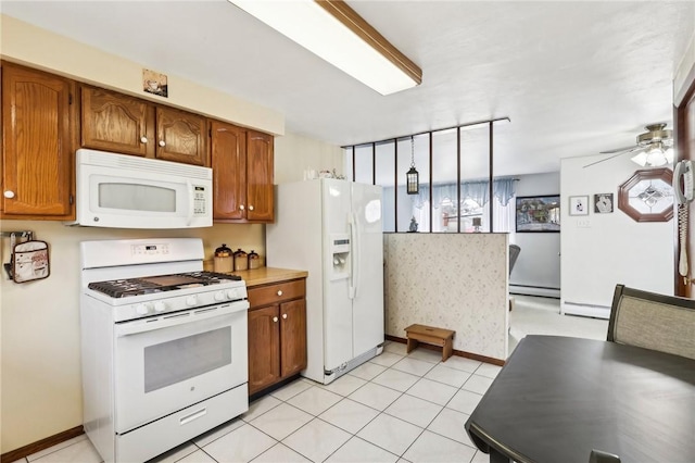 kitchen featuring light tile patterned floors, white appliances, ceiling fan, decorative light fixtures, and a baseboard radiator