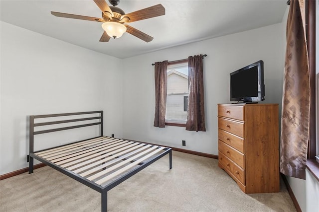 bedroom with light colored carpet and ceiling fan