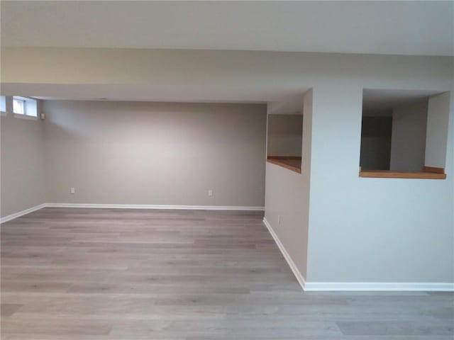 basement featuring light hardwood / wood-style floors