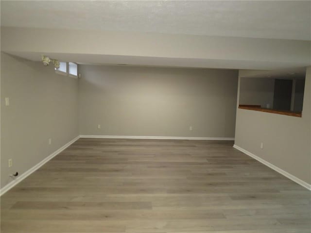 basement featuring light hardwood / wood-style flooring