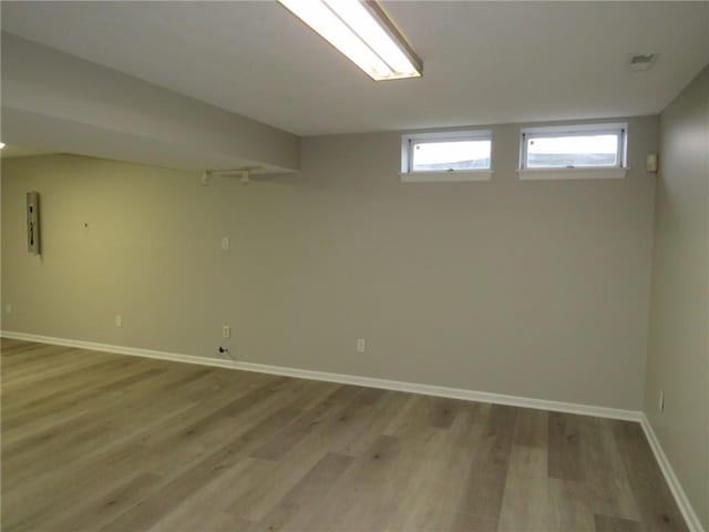 basement featuring light wood-type flooring