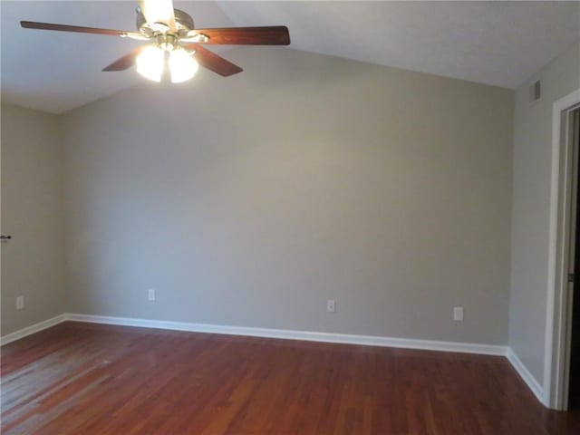 spare room with dark hardwood / wood-style floors and ceiling fan