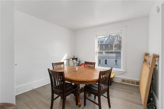 dining room with hardwood / wood-style flooring