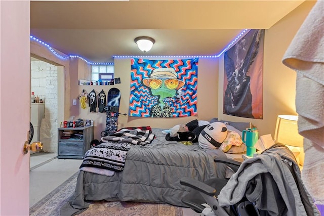 bedroom featuring concrete floors