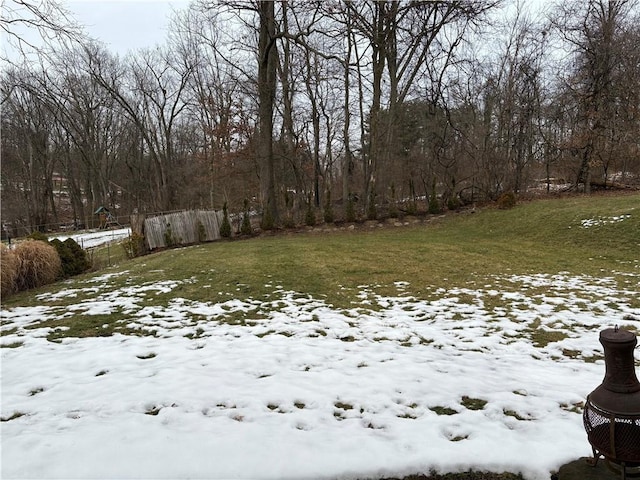 view of yard layered in snow