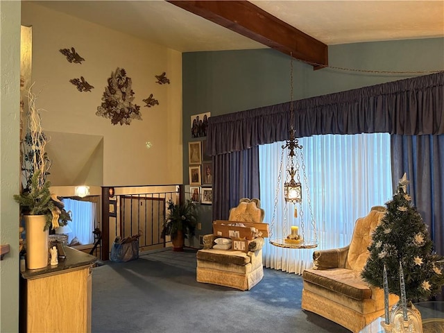 living area featuring lofted ceiling with beams and carpet floors