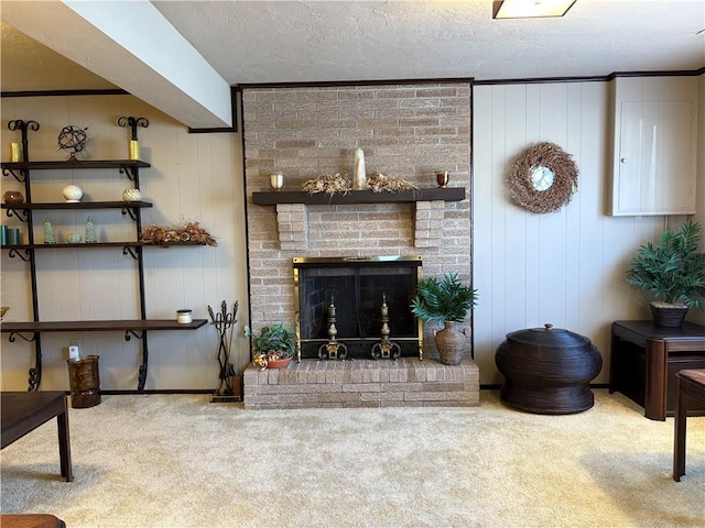 living area with light carpet, a brick fireplace, and a textured ceiling