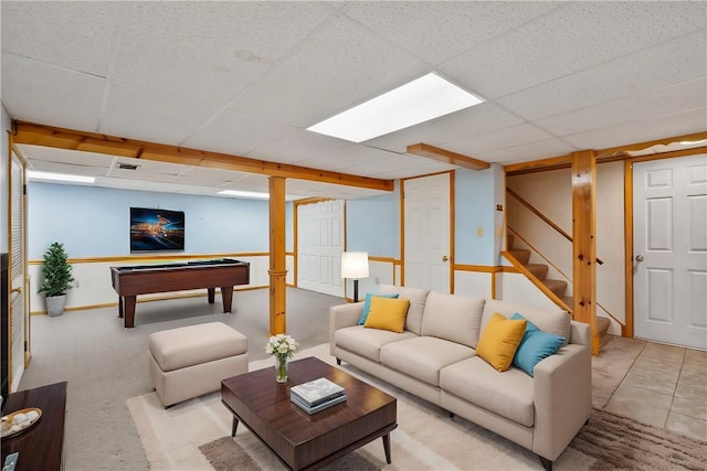 carpeted living room featuring a drop ceiling and billiards