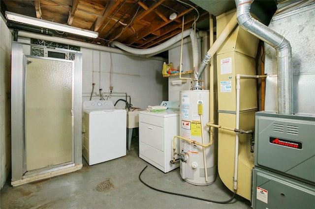 interior space with gas water heater and washer and dryer