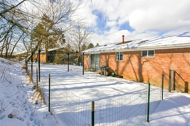 view of yard layered in snow