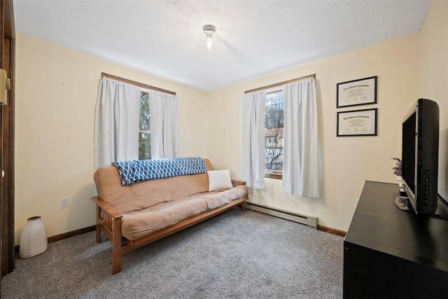 living area featuring carpet, a textured ceiling, and baseboard heating