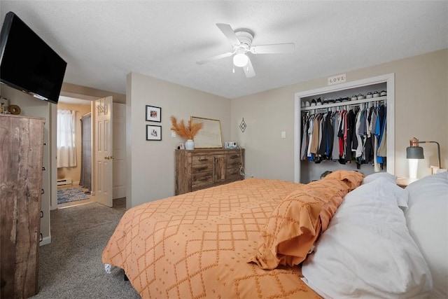 carpeted bedroom with a textured ceiling, a closet, and ceiling fan