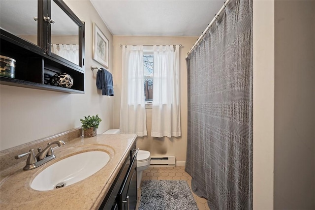 bathroom featuring tile patterned floors, toilet, vanity, and a baseboard heating unit