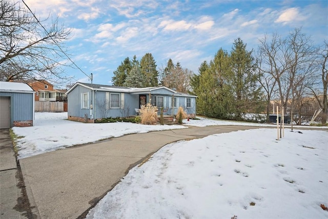 view of front of property featuring an outbuilding and a garage