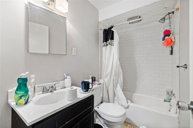 full bathroom featuring vanity, toilet, and shower / bath combo with shower curtain