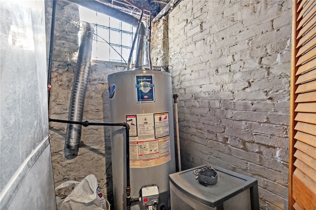 utility room with gas water heater