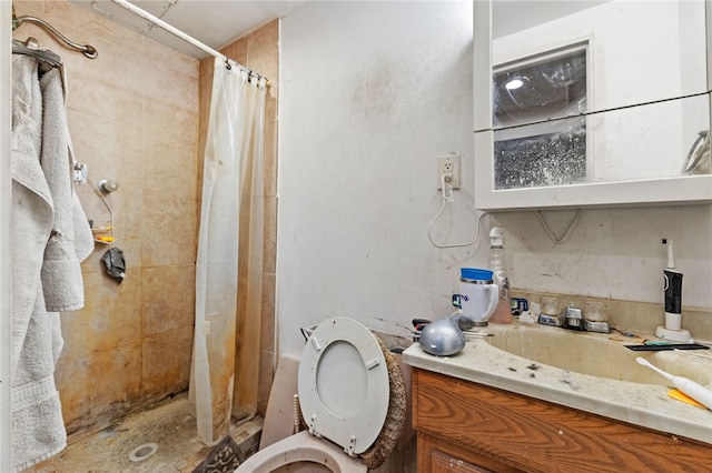 bathroom featuring vanity, toilet, and walk in shower