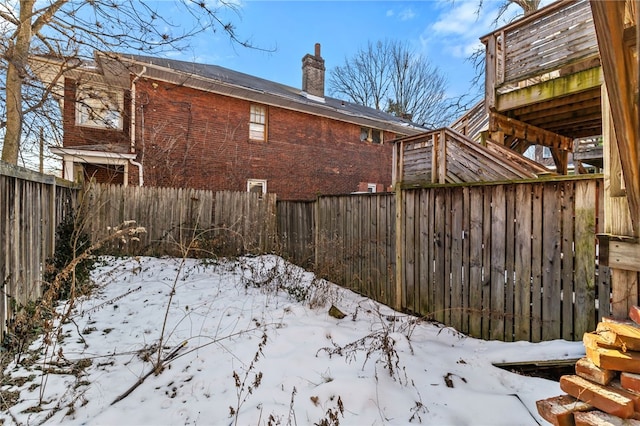 view of yard covered in snow