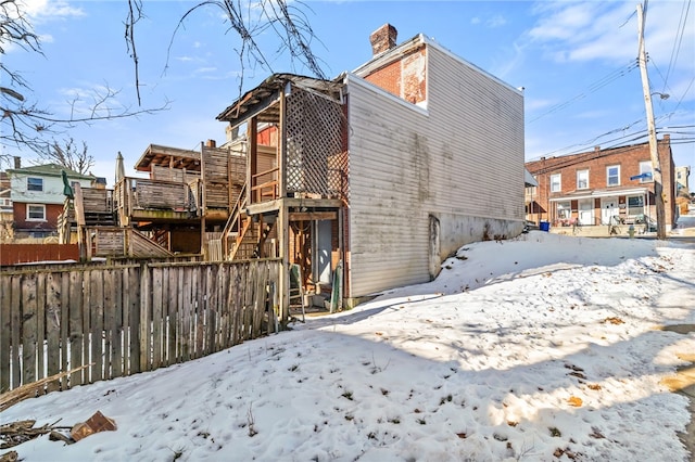 view of snow covered house