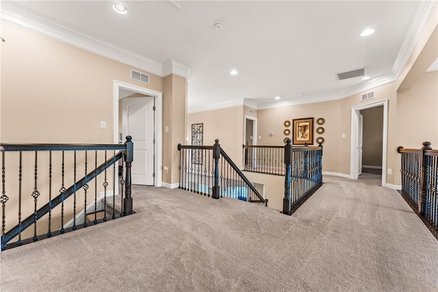 hall featuring ornamental molding and carpet floors