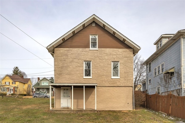 back of house with a yard