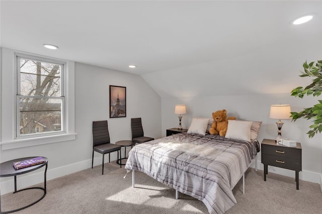 carpeted bedroom featuring lofted ceiling