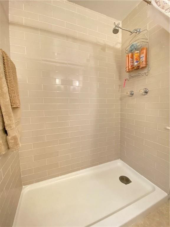 bathroom with tiled shower