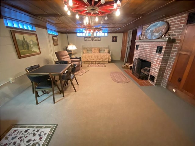 living room with a fireplace and carpet