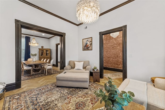 sitting room with parquet floors, ornamental molding, and a chandelier