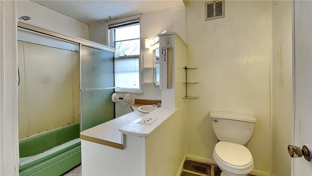 full bathroom featuring vanity, bathtub / shower combination, and toilet