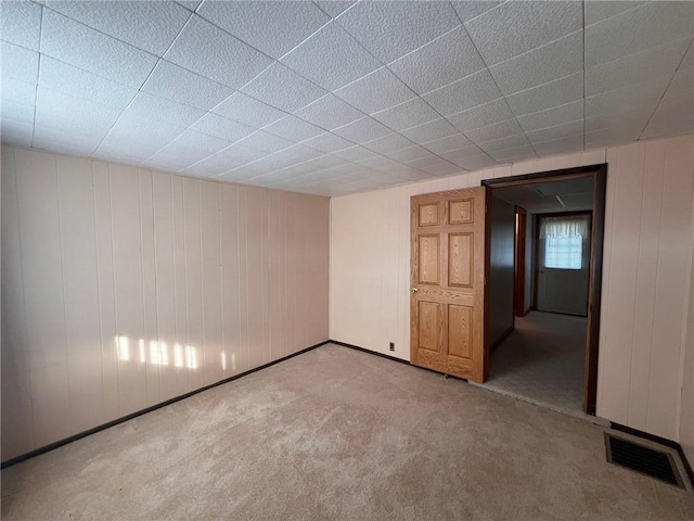 spare room with carpet flooring and baseboards