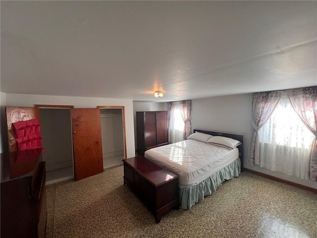 bedroom with multiple windows