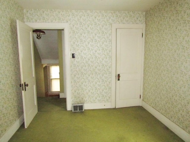 empty room with carpet flooring