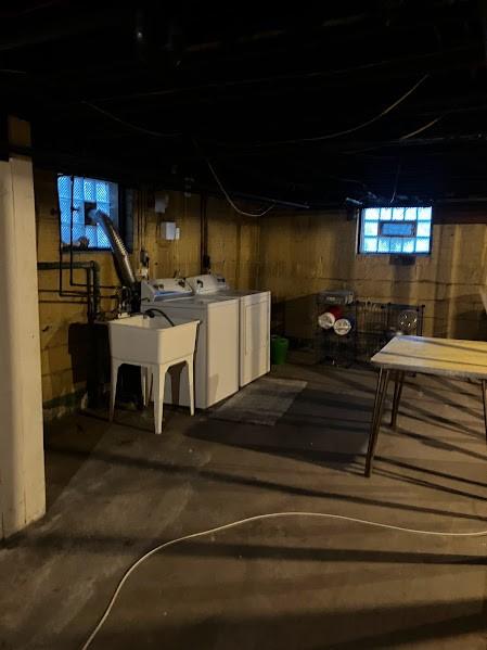 basement featuring sink and washing machine and clothes dryer