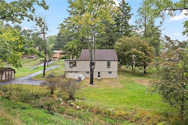 view of property exterior with a garage and a yard