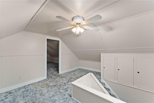 bonus room featuring lofted ceiling, light carpet, and ceiling fan