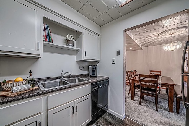 kitchen with sink, gray cabinetry, dark hardwood / wood-style floors, dishwasher, and a notable chandelier