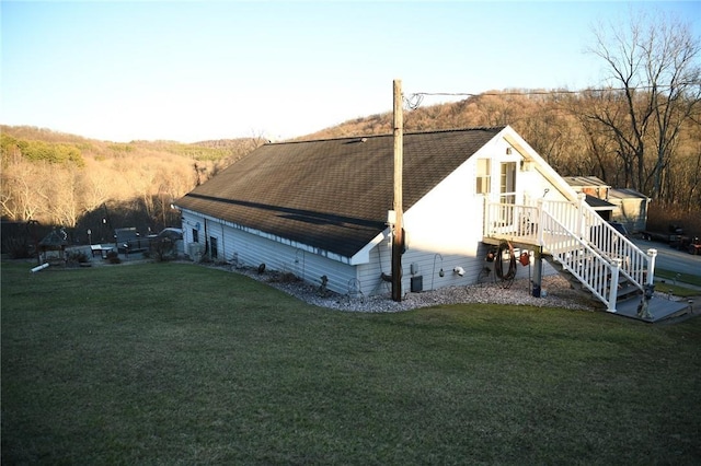 back of house featuring a yard