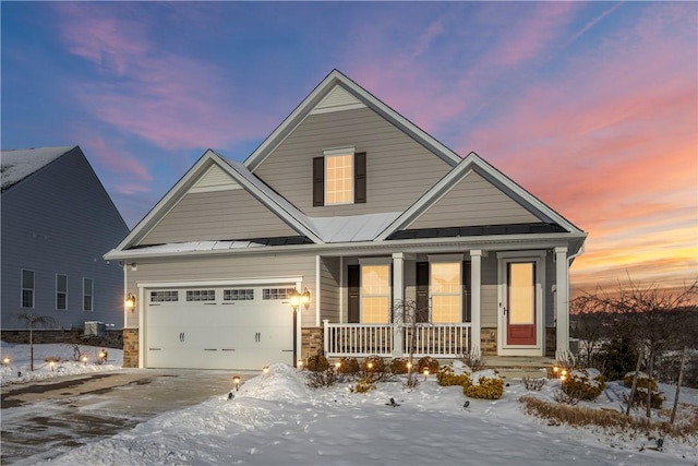 craftsman inspired home with a porch and a garage