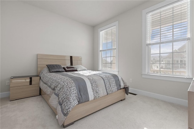 bedroom with light colored carpet